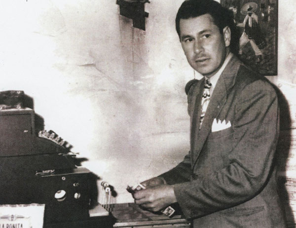 George Salisbury at the cash register in 1927